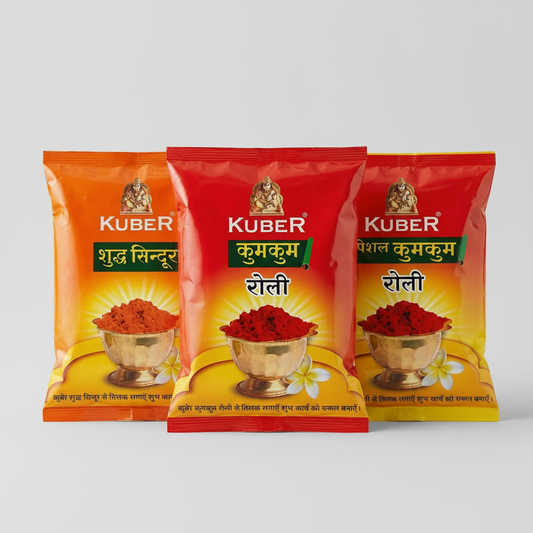 Three Kuber brand spice packets on a light background