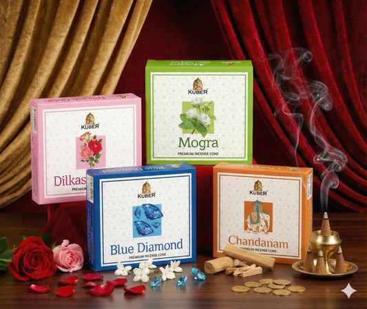 Kuber incense cones packaging with decorative elements on a wooden surface.